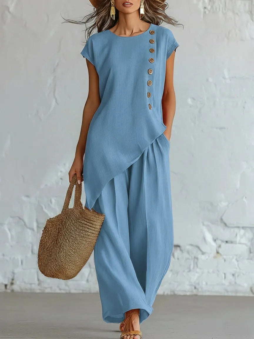 A round-neck, asymmetrical short-sleeved top and wide-leg trousers set with wooden buttons